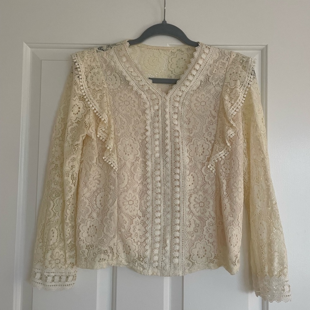 Beige vintage blouse with lace.